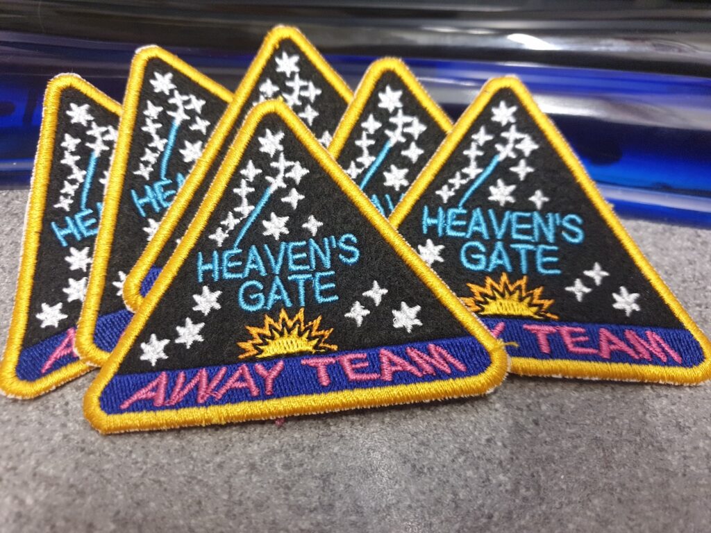 A photo of reproductions of the Heaven's Gate badges